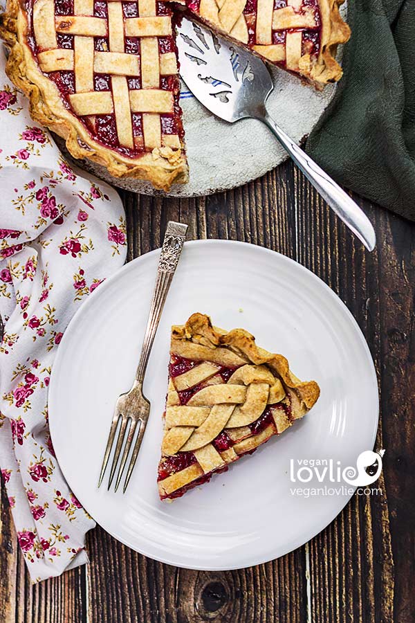 A slice of Cherry Rhubarb Pie on a plate