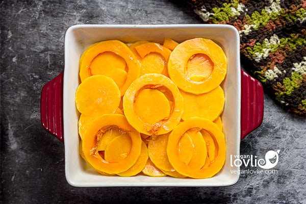 Butternut squash, placed in a baking pan