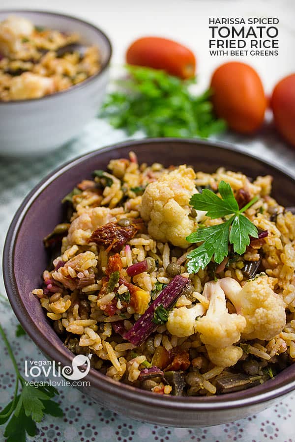 harissa spiced tomato fried rice with beetroot greens